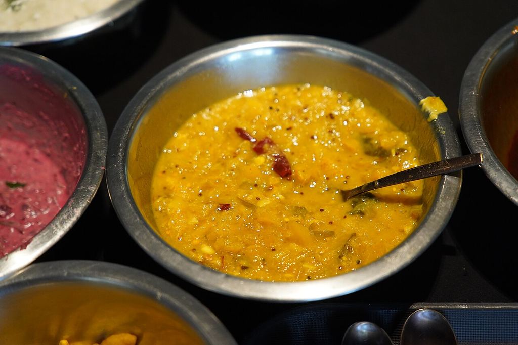 Bowls of Kerala curries served for a sadya